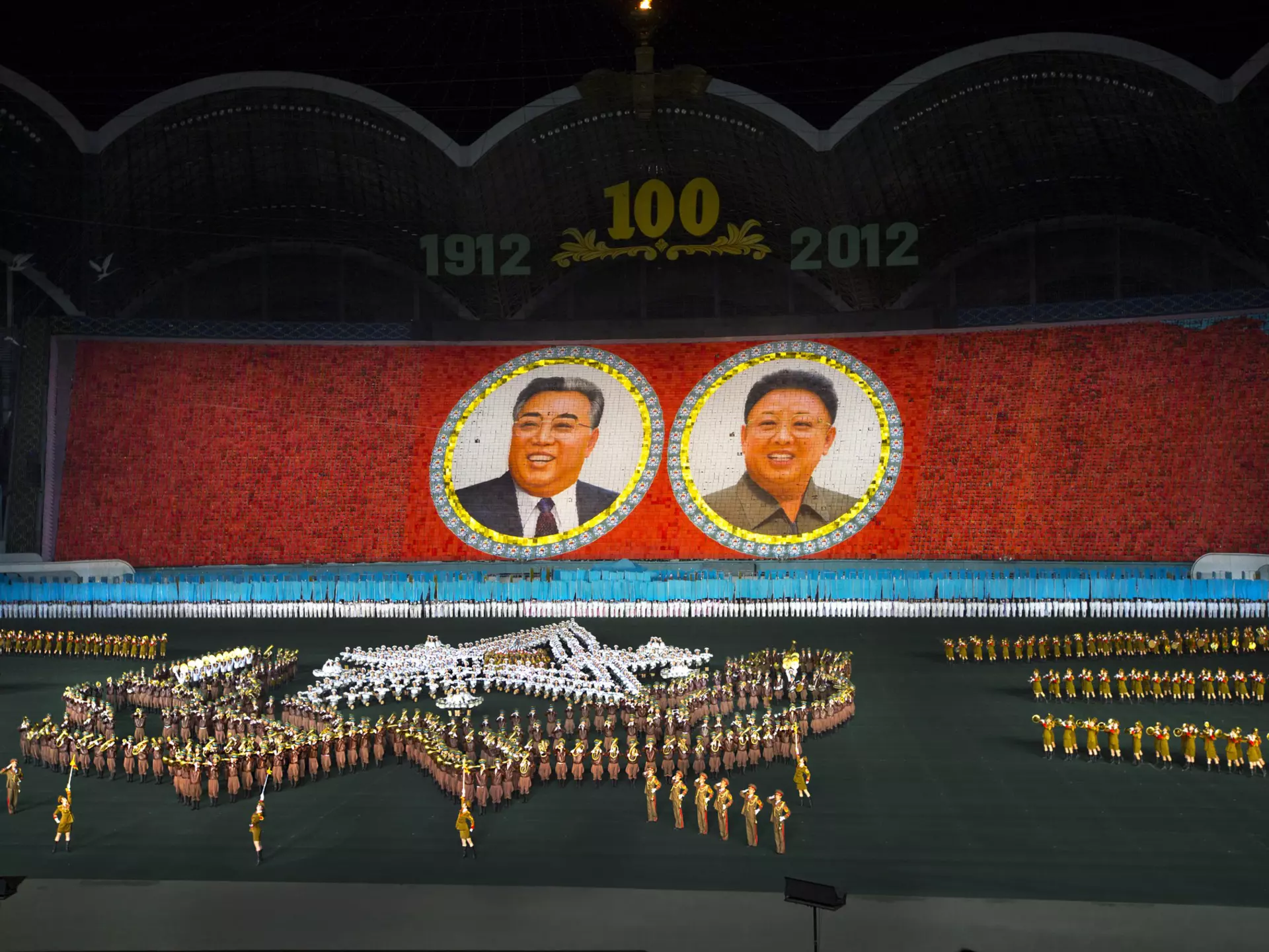 Over 100,000 performers tell tale of North Korea’s history at Mass Games in Pyongyang May Day Stadium.
Arirang, Arts culture and entertainment, Asia, Asian, Awe, Axis of evil, Capital, Capital cities, Celebration, Celebration event, Choregraphy, Clothing, Color, Color image, Colour, Creativity, Democratic people's republic of korea, Dictatorship, Dpkr, Dprk, Eti 2198, Event, Flag, High angle view, Horizontal, Large goup of people, Mass, Mass game, Mass games, Mass mouvement, May day, May day stadium, Mosaic, Multi colored, Night, Nightshot, North korea, North korean, Occupation, Outdoor, Outdoors, People, Performance, Performer, Performing arts event, Photography, Politics, Propaganda, Pyongyang, Rungrado, Show, Skill, Stade, Stadium, Stage costume, Stalinist, Synchronization, Team event, Togetherness, Traditional clothing, Traditional culture, Traditional festival, Travel destination, Travel destinations