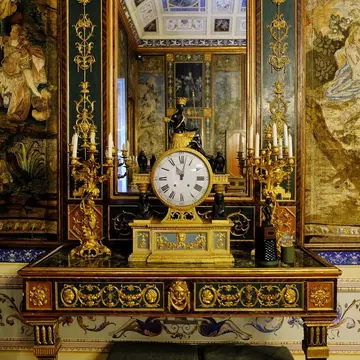 Luxury table clocks and candlesticks in the interior of the house of a aristocratic family (Palazzo Mirto).