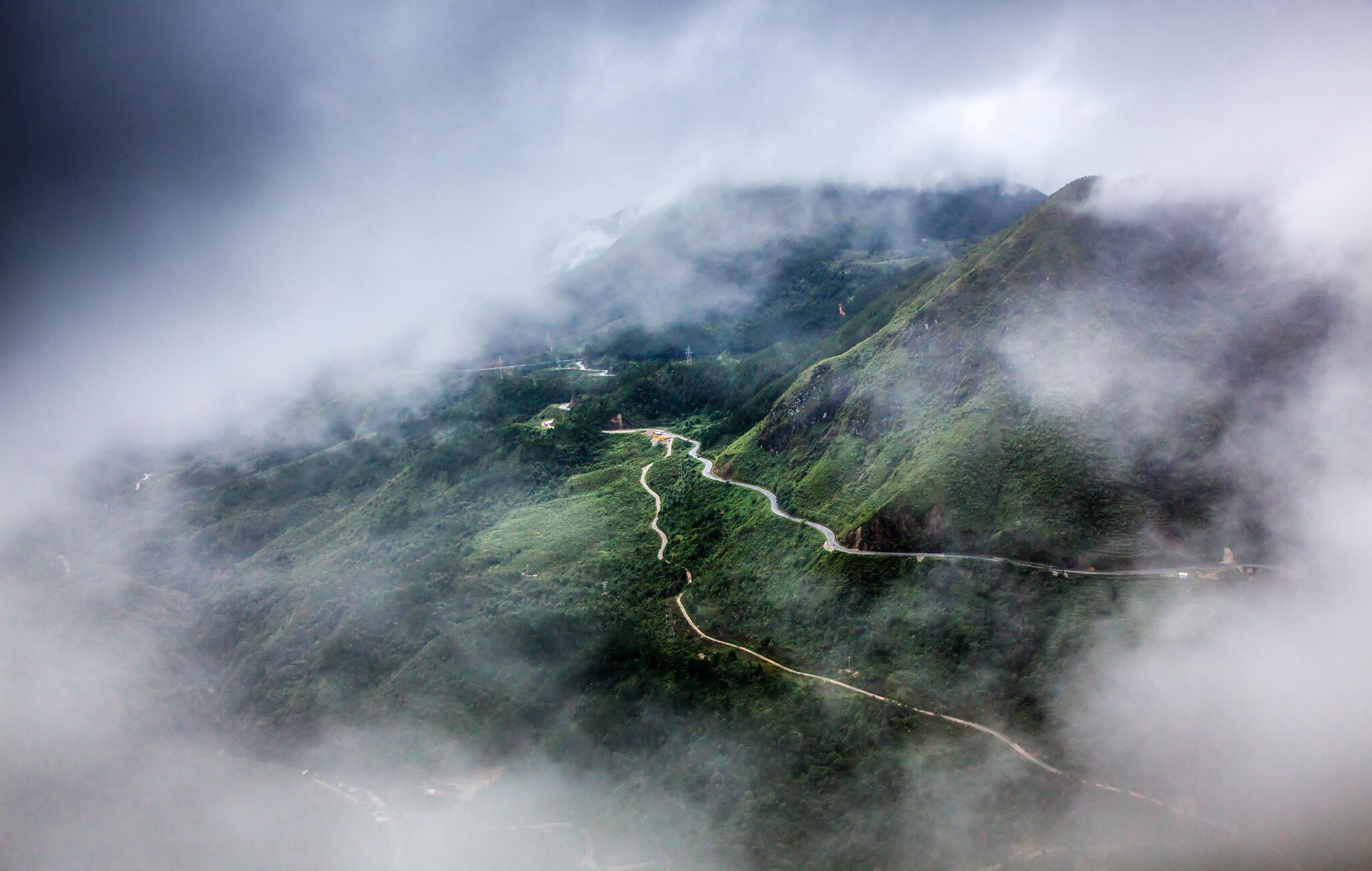 Aerial view of the Tram Ton Pass covered by fog in Sapa, Northwest Vietnam.