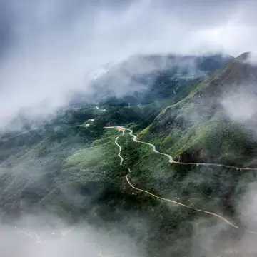 Aerial view of the Tram Ton Pass covered by fog in Sapa, Northwest Vietnam.