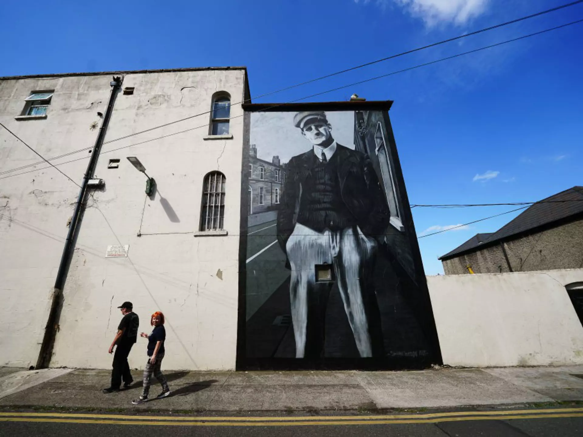 People walk past a mural of James Joyce by Shane Sutton Art on Richmond Street North in Dublin ahead of Bloomsday. Bloomsday is a celebration of the life of Irish writer James Joyce, observed annually worldwide on June 16, the day his 1922 novel Ulysses takes place in 1904, the date of his first outing with his wife-to-be Nora Barnacle. The day is named after its protagonist Leopold Bloom. Picture date: Wednesday June 15, 2022. (Photo by Brian Lawless/PA Images via Getty Images)
1241329170
People walk past a mural of James Joyce by Shane Sutton Art on Richmond Street North in Dublin ahead of Bloomsday. Bloomsday is a celebration of the life of Irish writer James Joyce, observed annually worldwide on June 16, the day his 1922 novel Ulysses takes place in 1904, the date of his first outing with his wife-to-be Nora Barnacle. The day is named after its protagonist Leopold Bloom. Picture date: Wednesday June 15, 2022. (Photo by Brian Lawless/PA Images via Getty Images)
