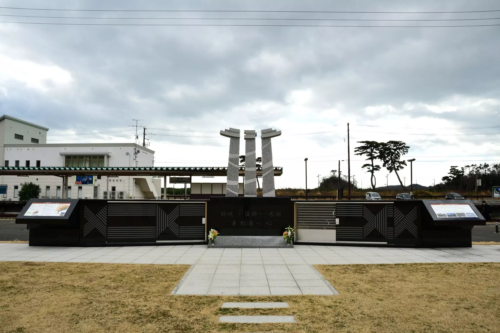 A large stone memorial in a square.