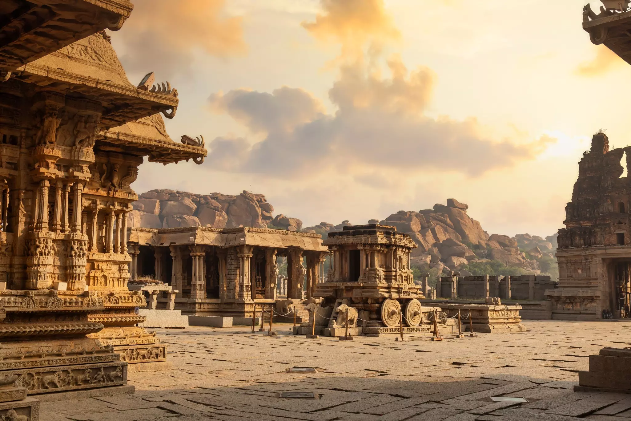 The ruins of the Vittala Temple complex at sunrise in Hampi, Karnataka, India.