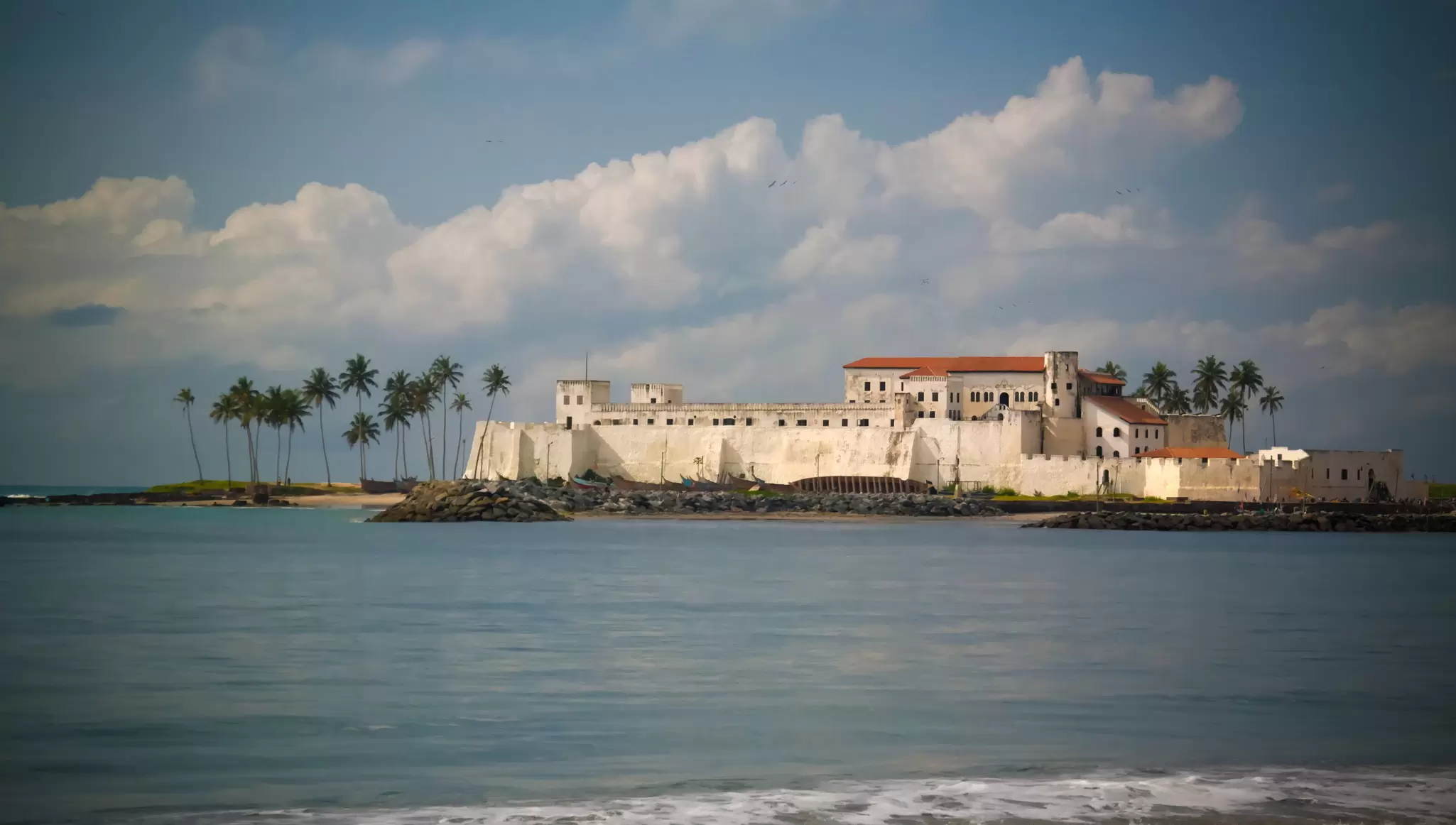 An old coastal fortress with white walls: Elmina Castle, Ghana