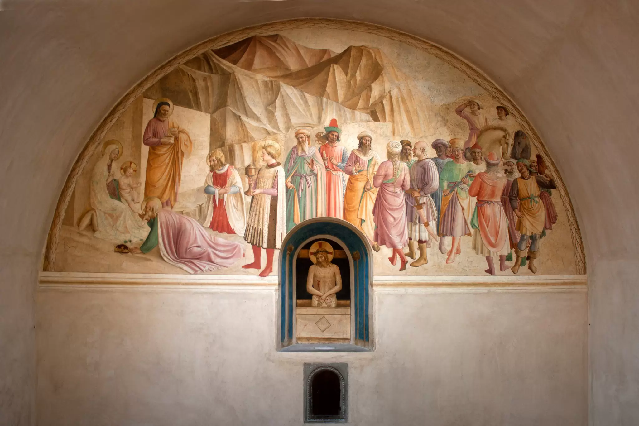 A fresco on the wall of a chapel in a church depicts Christ and numerous other figures