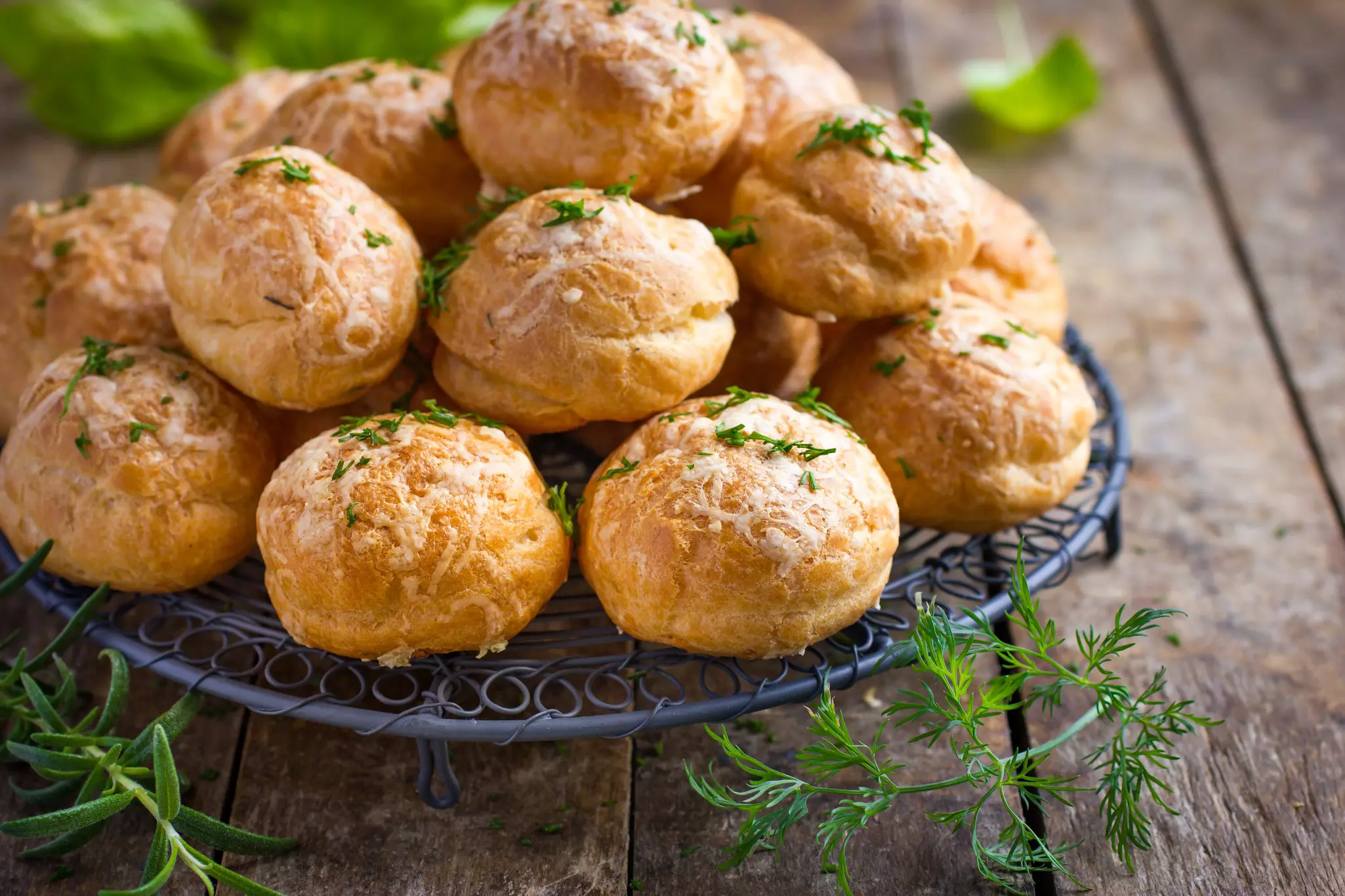 A plate loaded with small round savory pastries