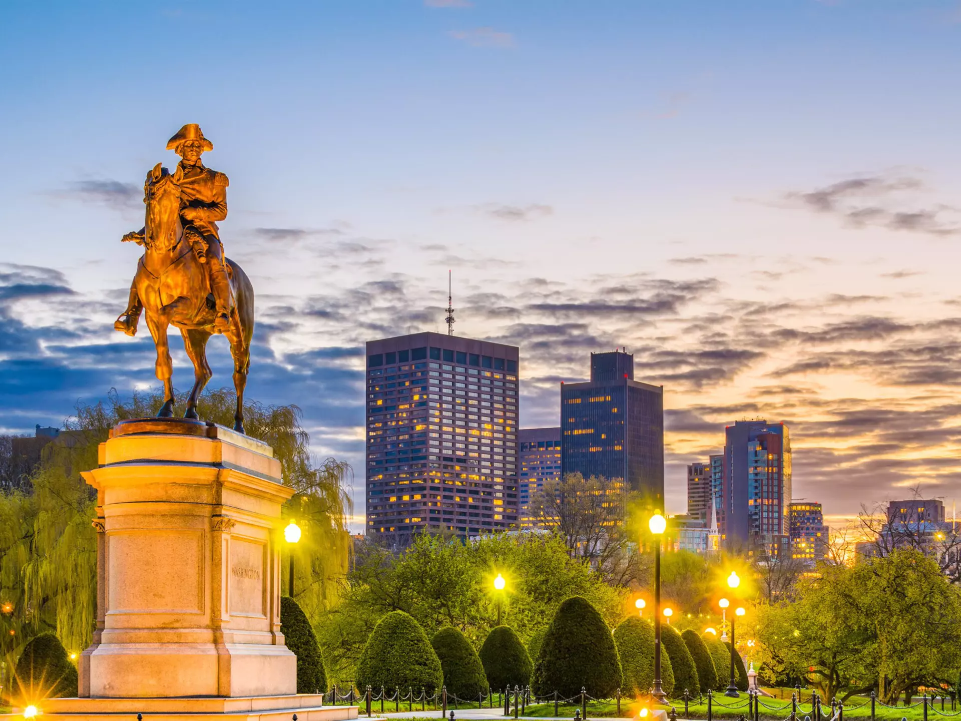 The skyline of Boston's Public Garden at sunset