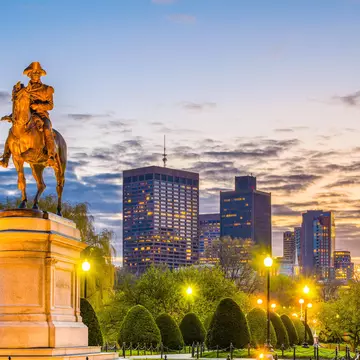 The skyline of Boston's Public Garden at sunset