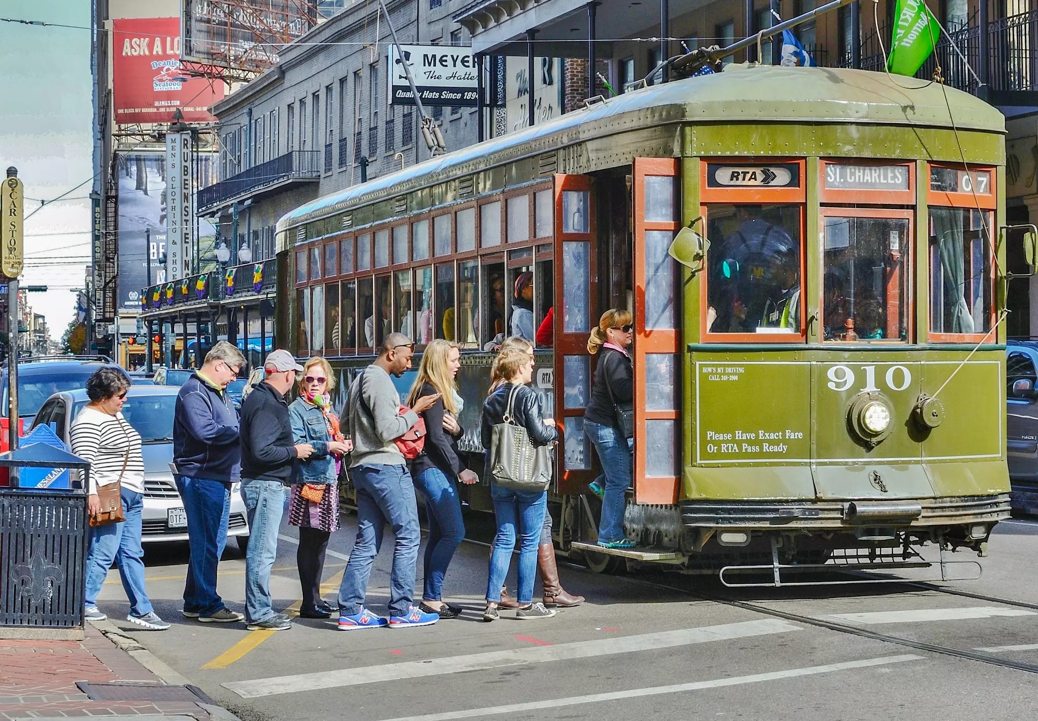 People in line to board a streetcar in New Orleans, Louisiana, USA.