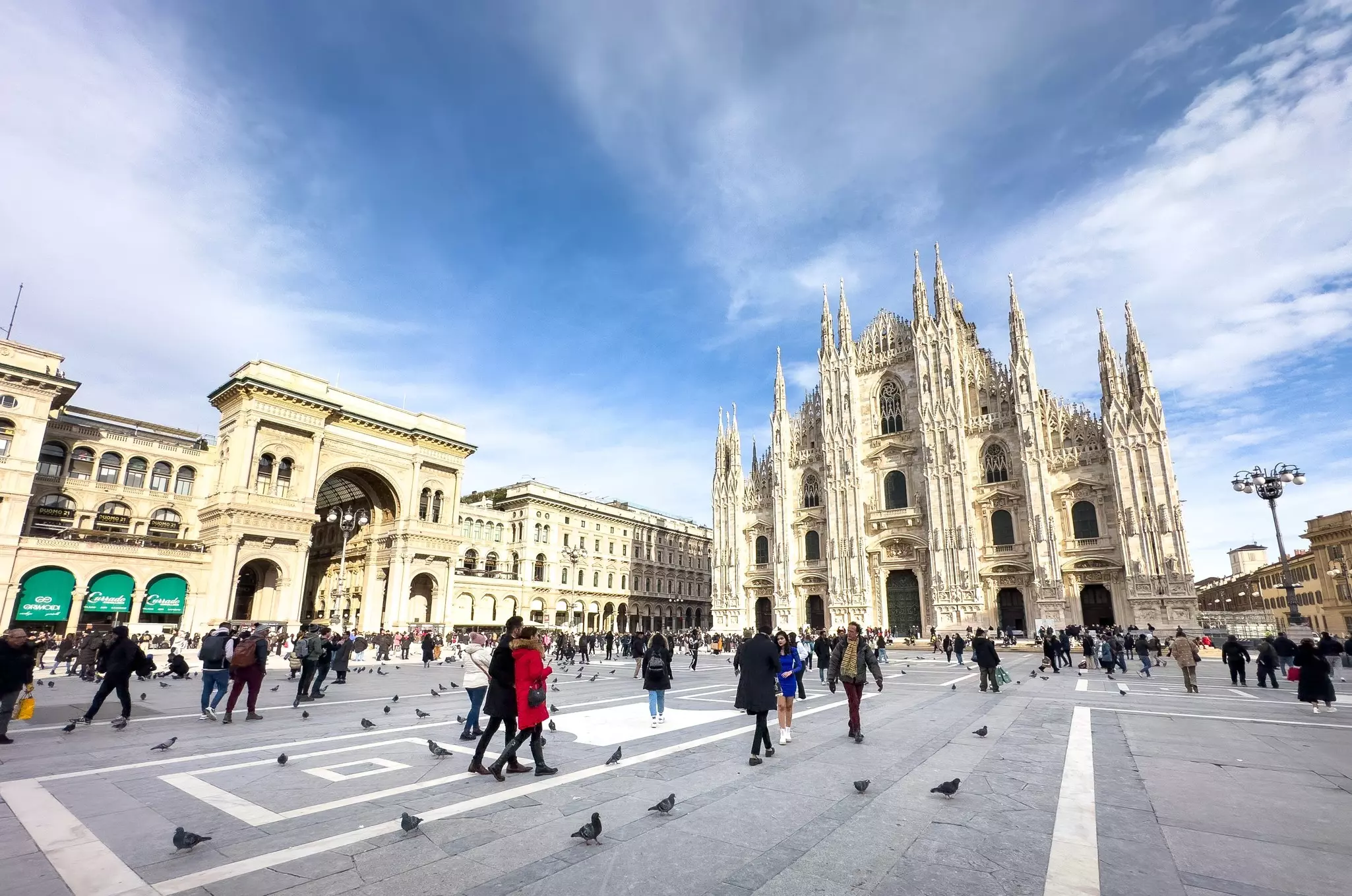 Milan  Italy - Jan 22 2024: People walk in the Piazza del Duomo in front of the Duomo di Milano, the catholic cathedral in the city in Italy., License Type: media, Download Time: 2024-12-16T19:01:07.000Z, User: comptonsheldon109, Editorial: true, purchase_order: 56530 - Guidebooks, job: Global Publishing WIP, client: Italian Lakes 4, other: Compton Sheldon