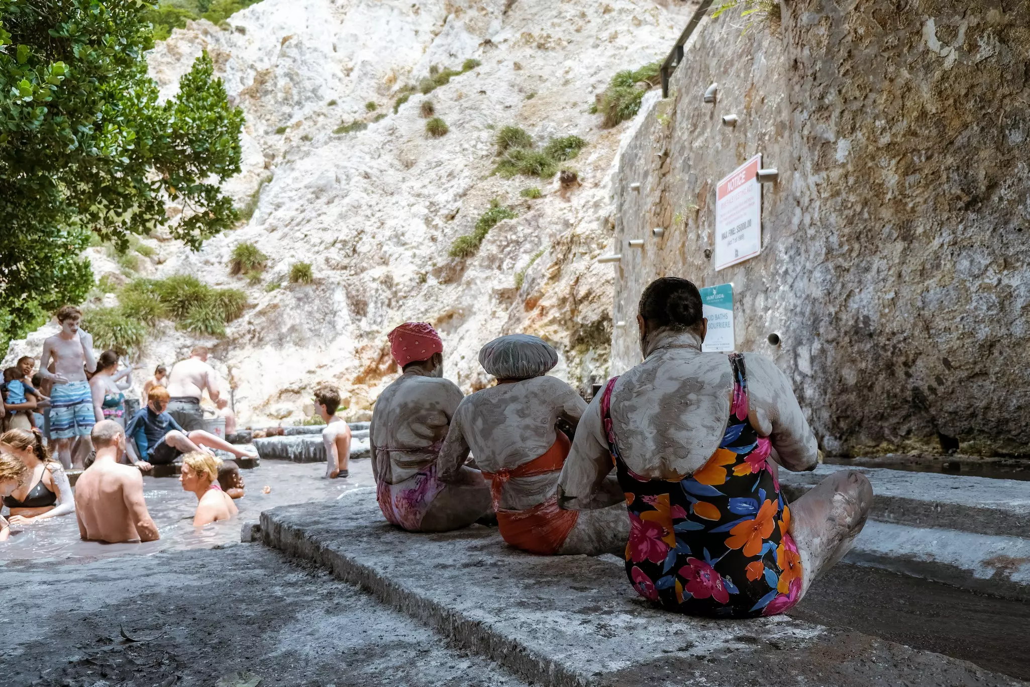 Soufriere sulphur springs, st. lucia, caribbean April 2019, people in mud bath taking mud treatment