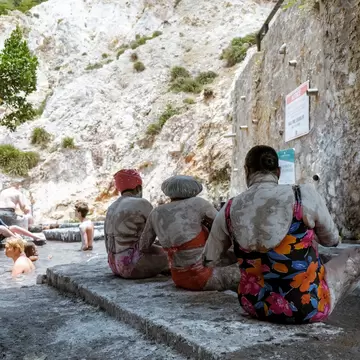 Soufriere sulphur springs, st. lucia, caribbean April 2019, people in mud bath taking mud treatment
