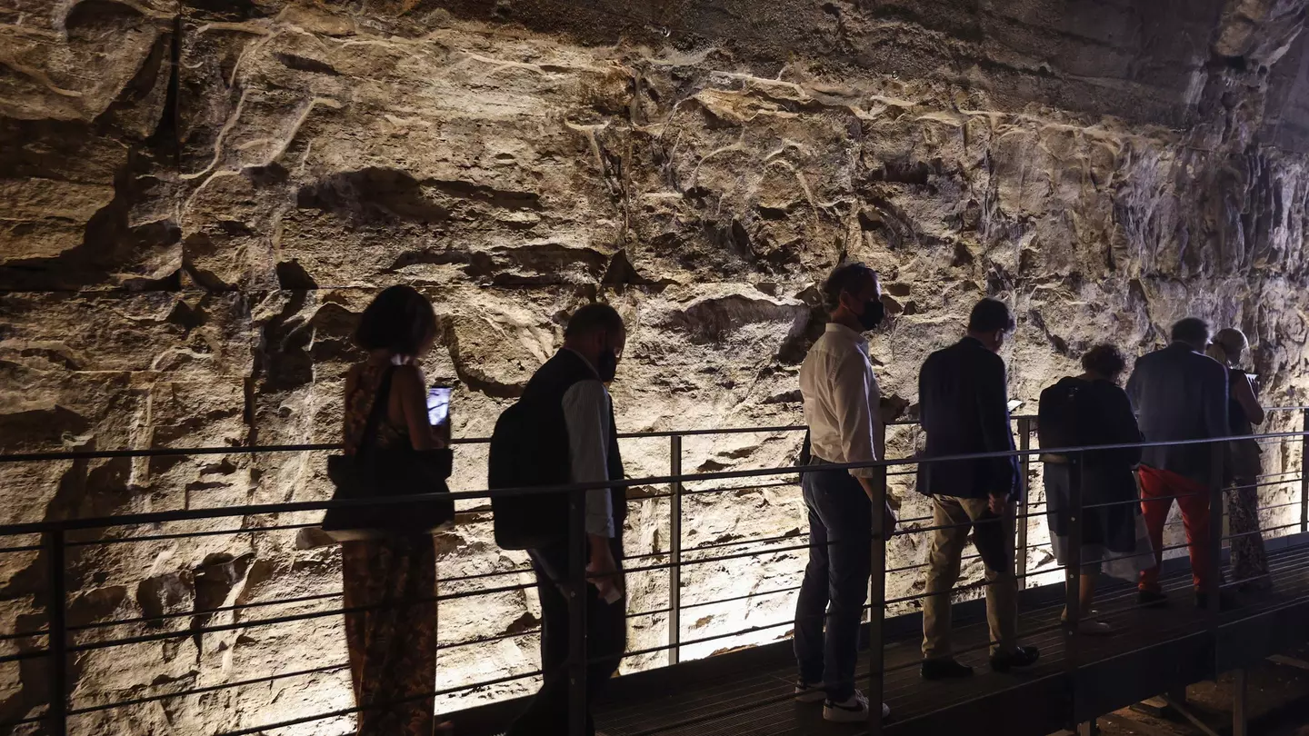 A group of reporters and guests enter the Hypogea area of the Colosseum