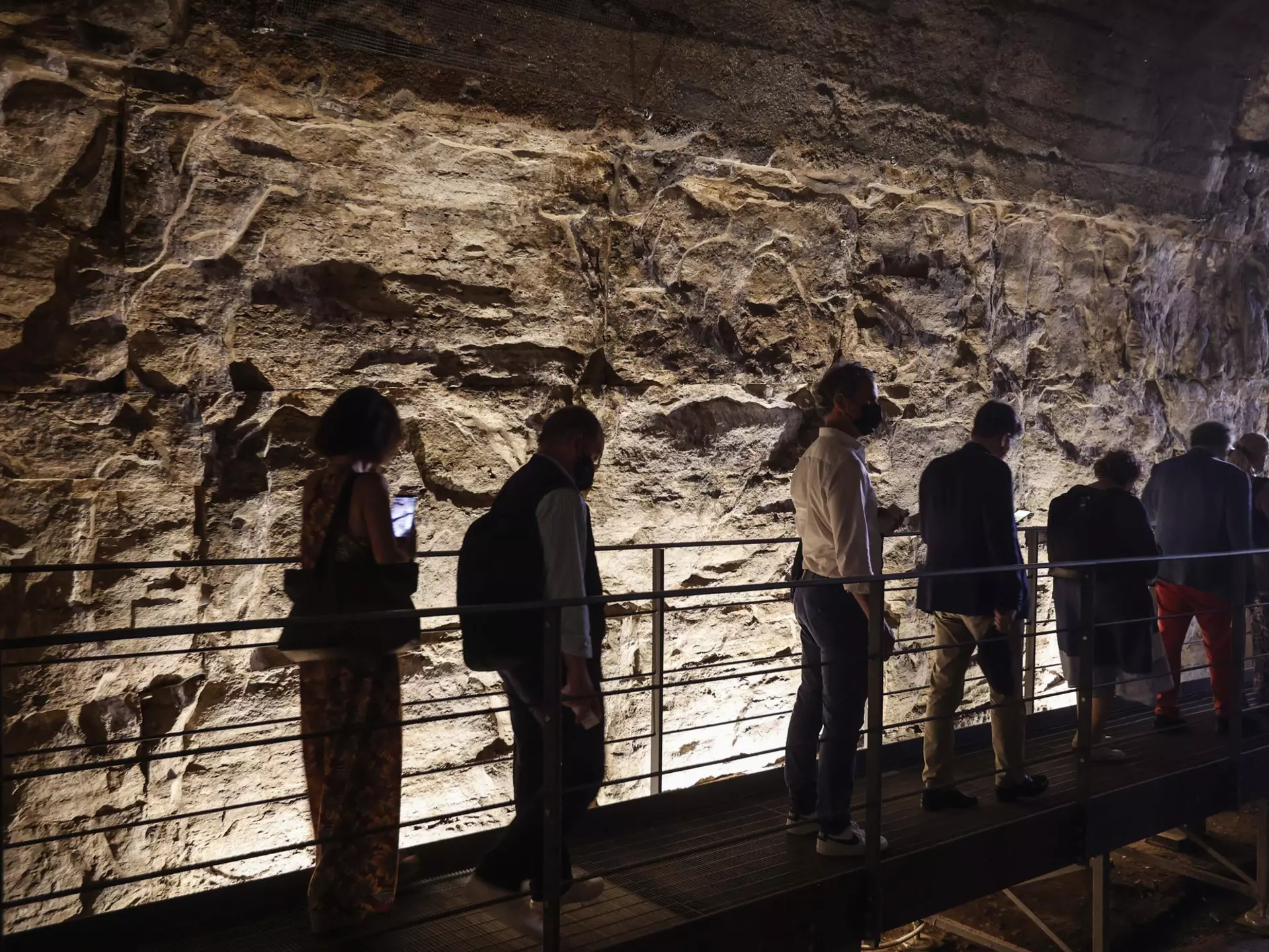 A group of reporters and guests enter the Hypogea area of the Colosseum