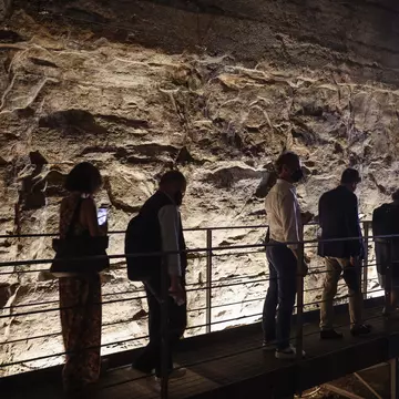 A group of reporters and guests enter the Hypogea area of the Colosseum