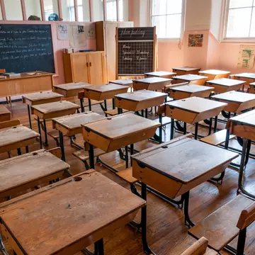 A classroom full of empty desks in Scotland Street School, Glasgow, Scotland.