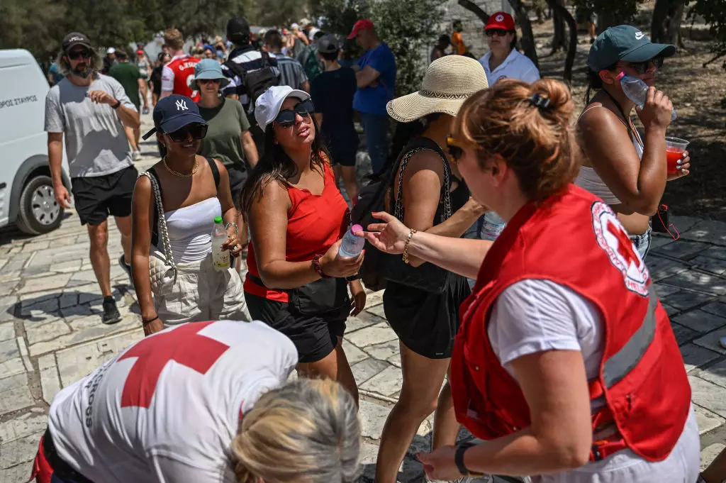 Red Cross workers distributed bottles of water to visitors outside the Acropolis last summer © Angelos Tzortzinis /AFP via Getty Images