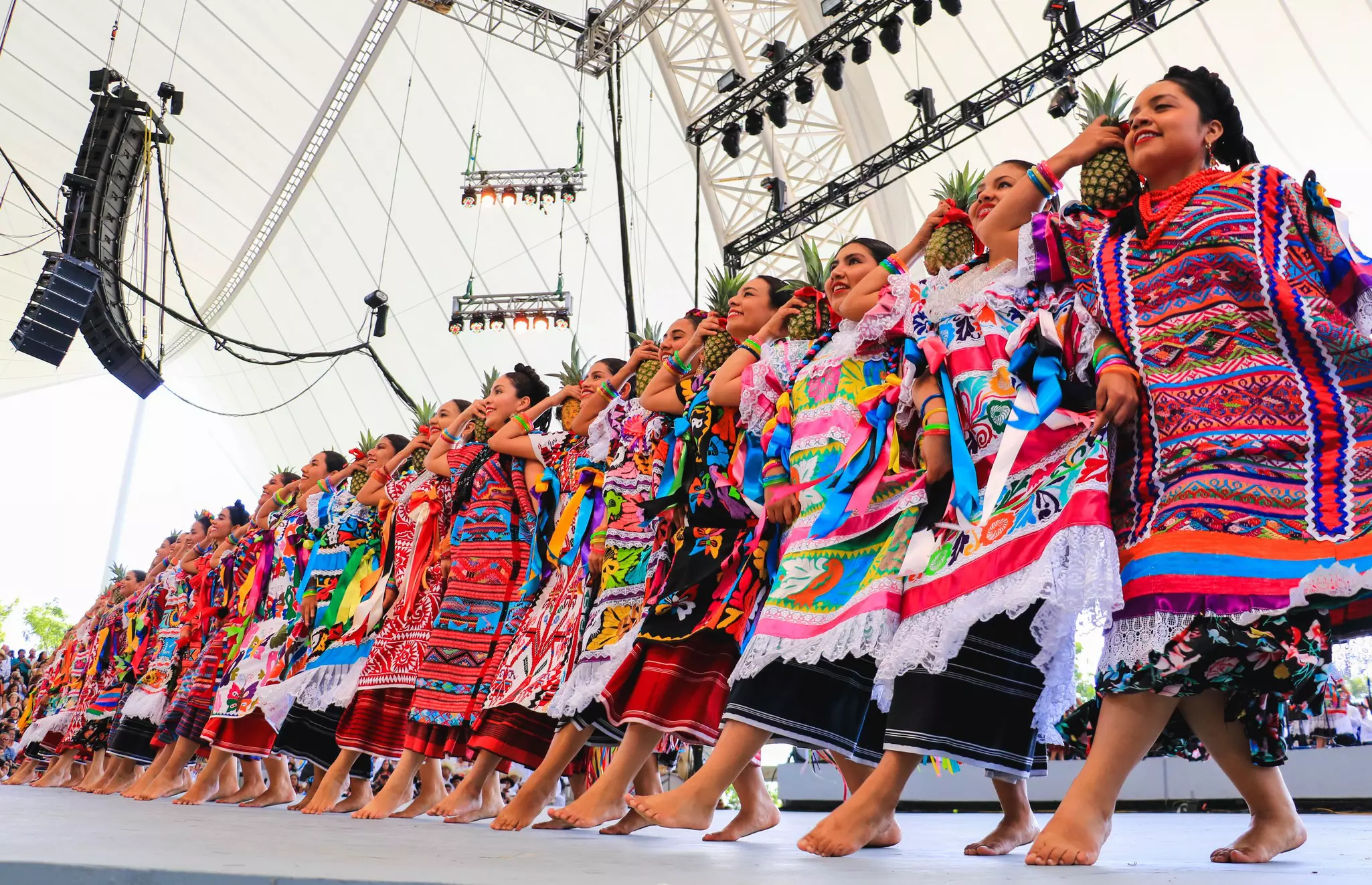 Oaxaca, Mexico-July 29: Oaxacan women dancing 'pineapple flower' (flor de piña) in the guelaguetza on July 29 2019, License Type: media, Download Time: 2025-10-09T02:10:35.000Z, User: bhealy950, Editorial: true, purchase_order: 65050 - Digital Destinations and Articles, job: Lonely Planet Online Editorial, client: Guide to Oaxaca, other: Brian Healy