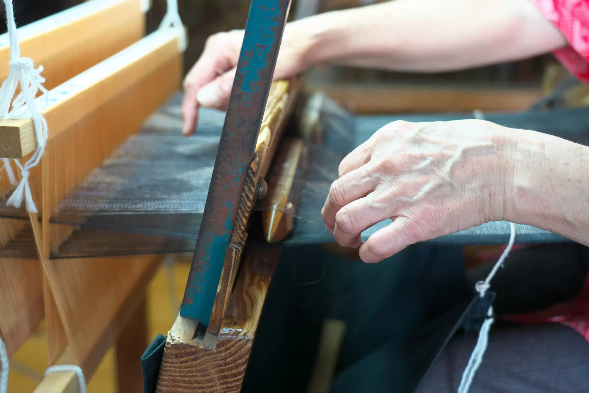View of an artisan weaving Ōshima Tsumugi on Amami-Ōshima in Japan.