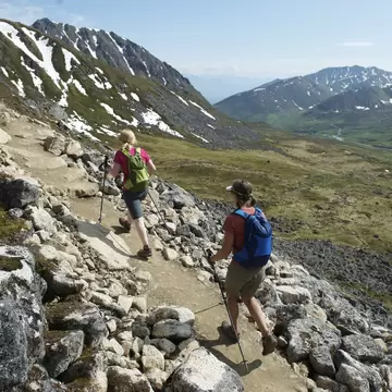 Hikers on the trail to Gold Cord Lake in Independence Mine State Historical Park at Hatcher Pass, Alaska June 2011. The half-mile trail leads to an alpine lake above the historic gold mine near Hatcher Pass.
