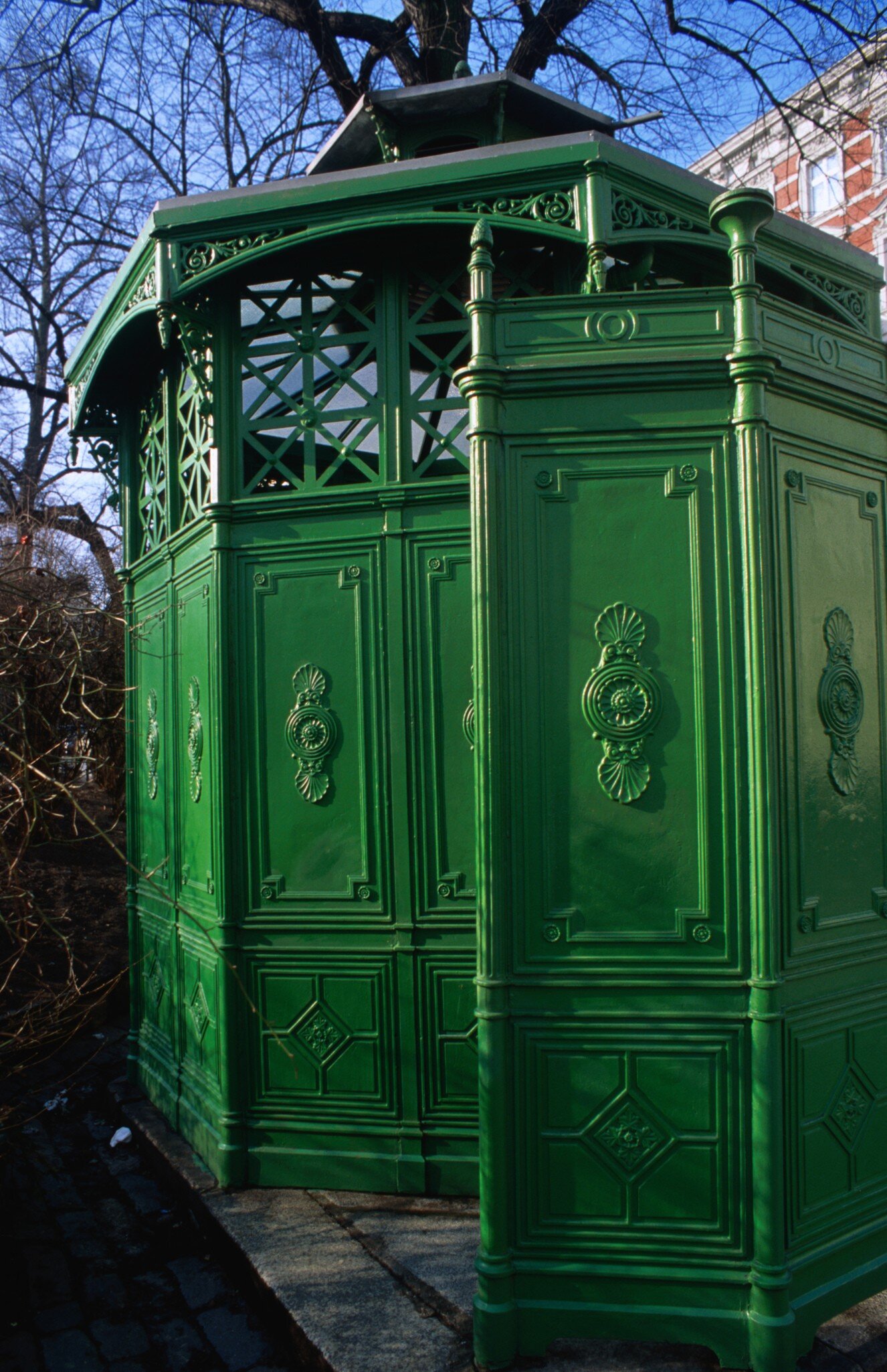 Green detail of Cafe Achteck, name of 19th century pissoir at Chamissoplatz, Kreuzberg, Germany.