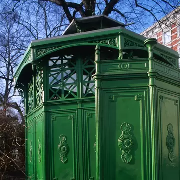 Green detail of Cafe Achteck, name of 19th century pissoir at Chamissoplatz, Kreuzberg, Germany.