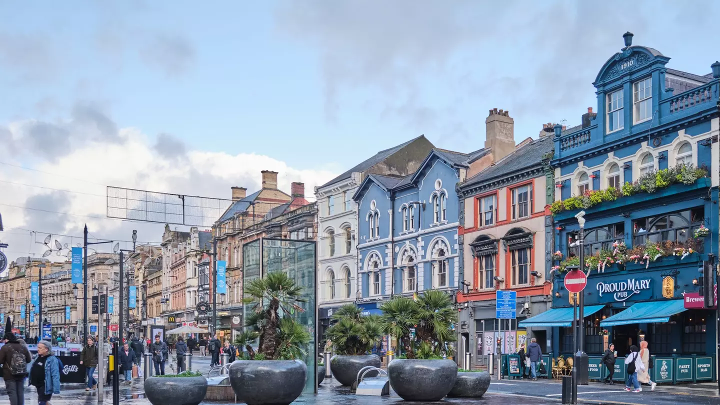 The buildings that line Cardiff Bay lit up against the night sky.