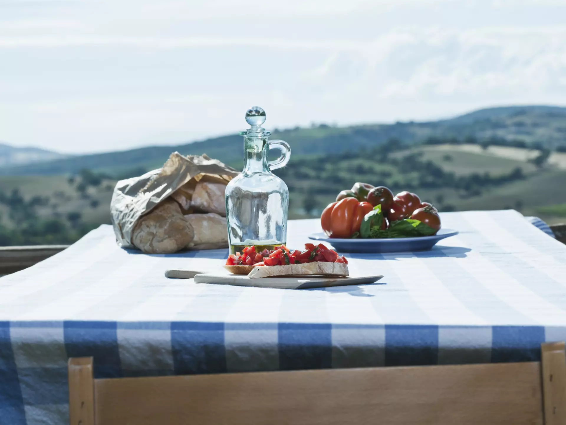 Italy, Tuscany, Magliano, Bruschetta, bread, tomatoes and olive oil on table
Bread; Bruschetta; Color Image; Cooking Oil; Cruet; Cultures; Day; Focus On Foreground; Food and Drink; Freshness; Healthy Eating; Horizontal; Italy; Juicy; Landscape; Magliano; Mediterranean Food; No People; Oil; Olive Oil; Outdoors; Photography; Plate; Ready-To-Eat; Ripe; Sky; Table; Tablecloth; Tomato; Tuscany; Vegetable;