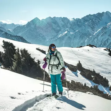 Ski touring in surroundings of ski resort in Kyrgyzstan.