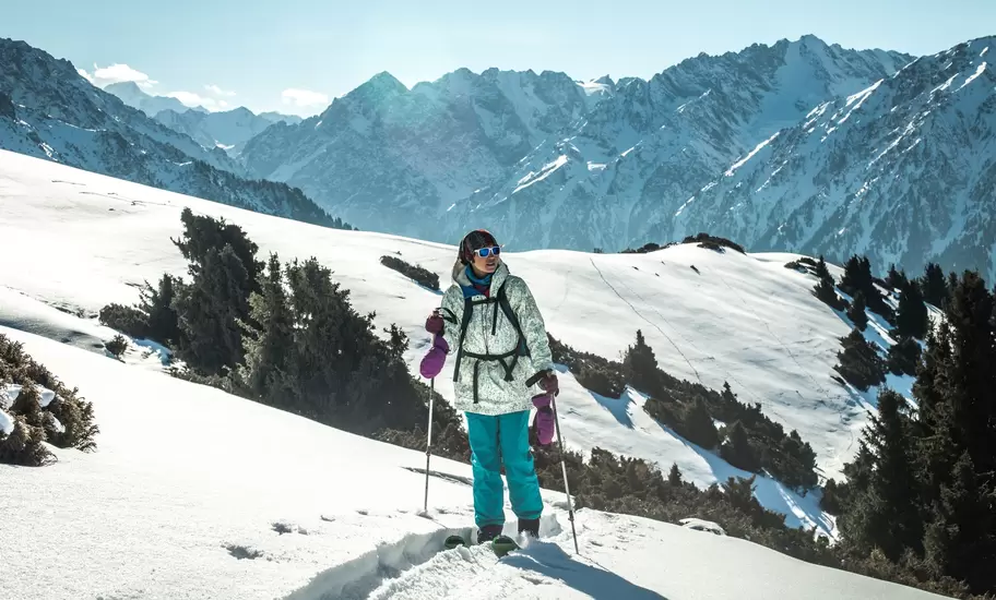 A cross-country skiier on a snow-filled mountain