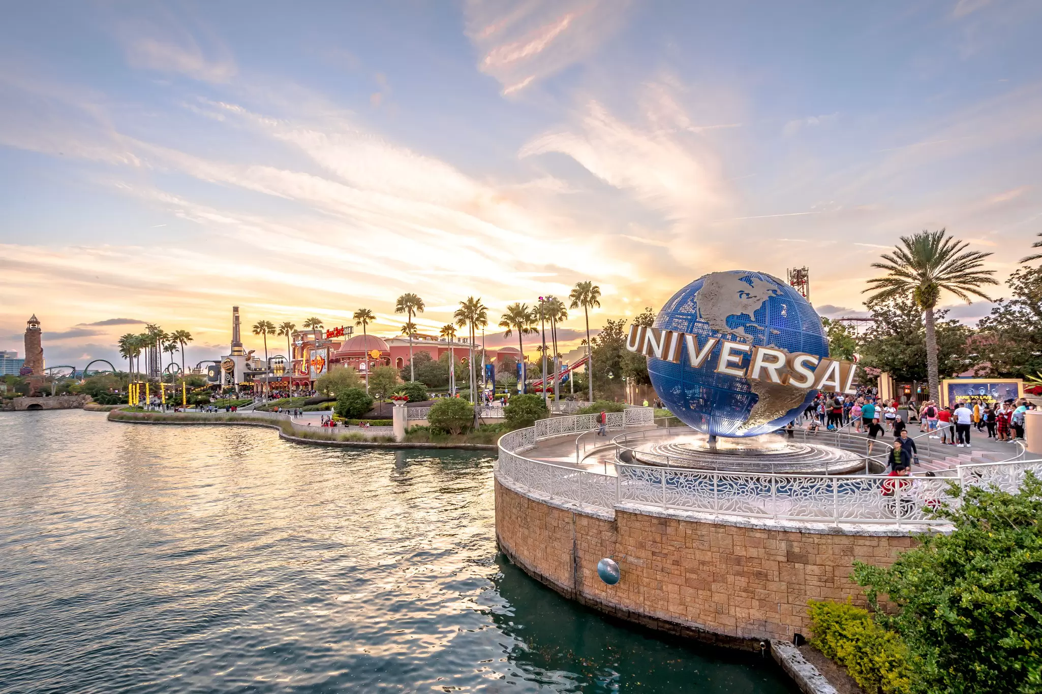 A waterfront at Universal Studios in Orlando, Florida, where a large globe structure welcomes visitors to the theme park