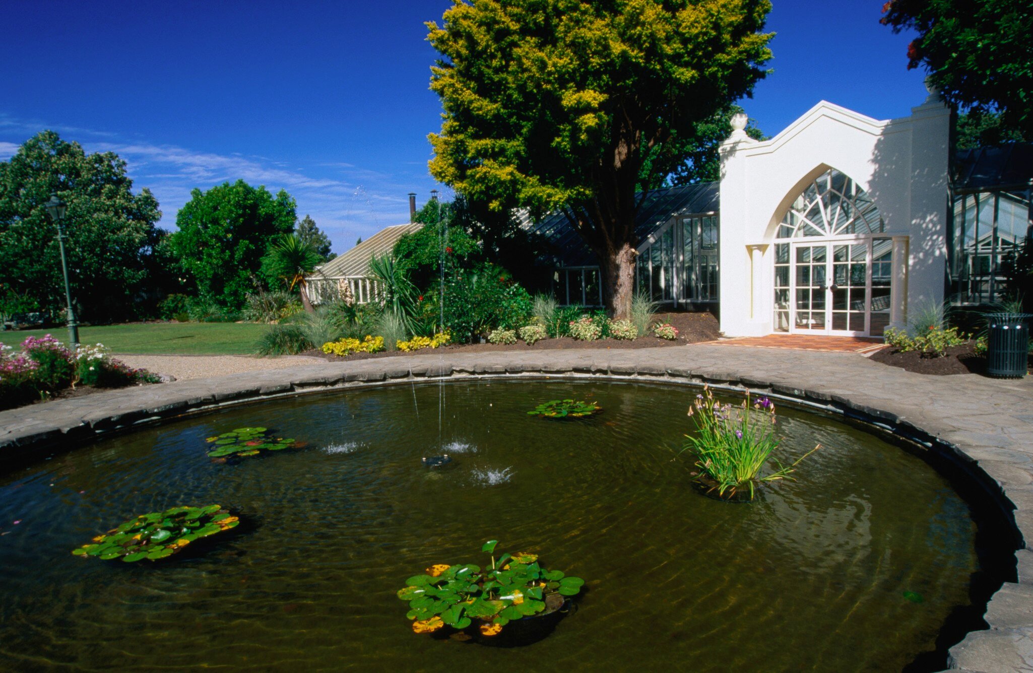 A greenhouse and a pond in Hamilton Gardens.
