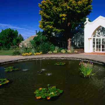 A greenhouse and a pond in Hamilton Gardens.
