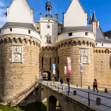Nantes, France - September 16, 2022: Gatehouse with two fortified towers and stone bridge at the entrance of the Château des ducs de Bretagne (Castle of the Dukes of Brittany)., License Type: media, Download Time: 2025-10-08T19:52:15.000Z, User: mvm_lonelyplanet, Editorial: true, purchase_order: 56530 - Guidebooks, job: France 16 , client: Global Publishing-WIP, other: Virginia Moreno