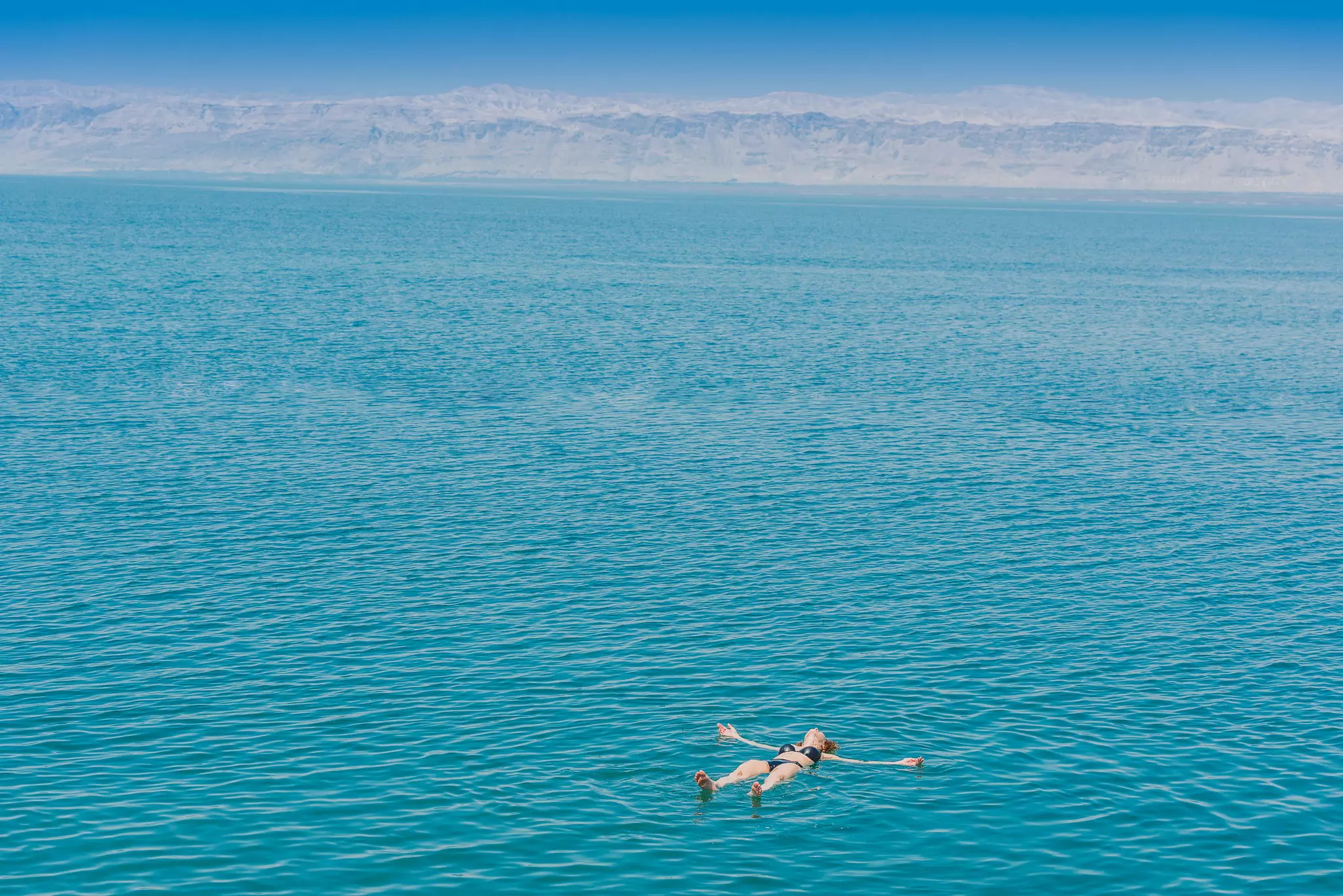 one woman swimming bathing in Dead Sea Jordan.