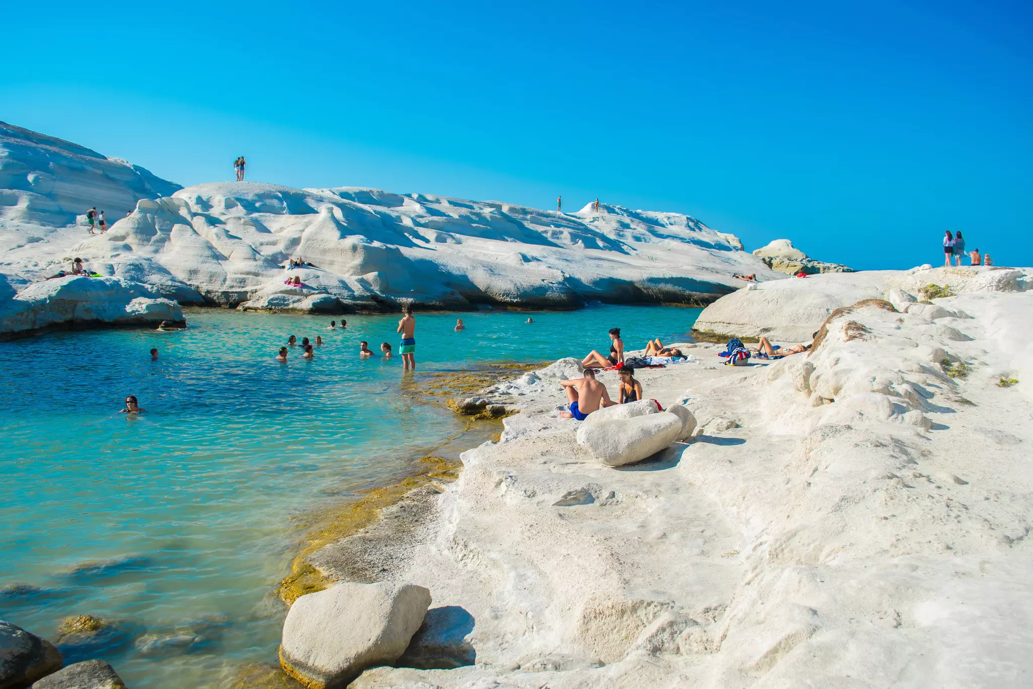 The volcanic beaches of Milos in the Cyclades. Andronos Haris / Shutterstock