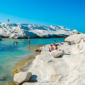 The volcanic beaches of Milos in the Cyclades. Andronos Haris / Shutterstock