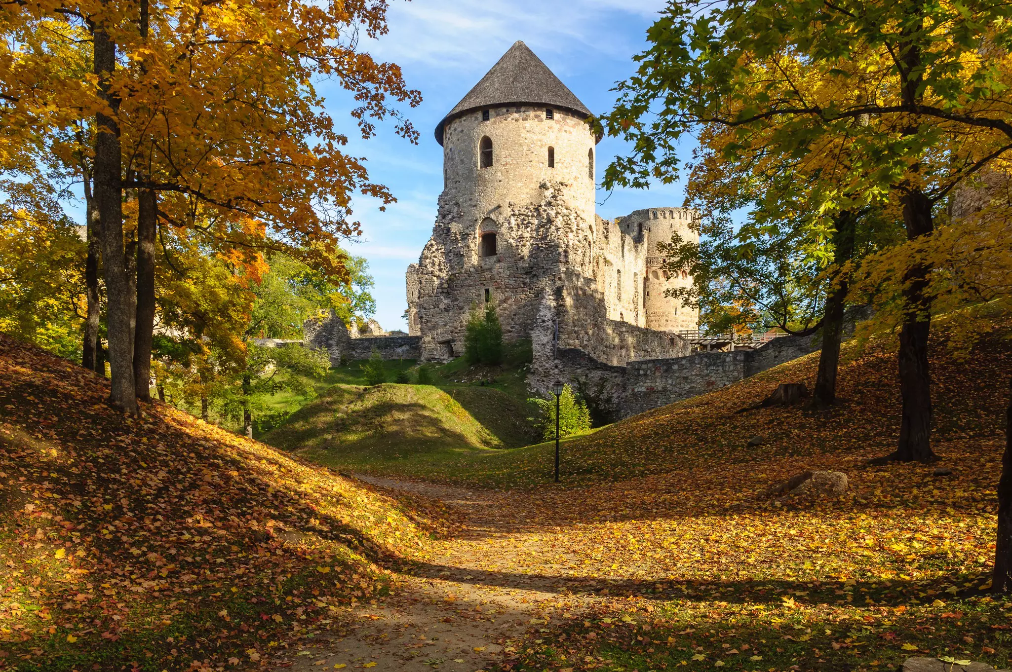 Autumn park with Cesis Castle ruins