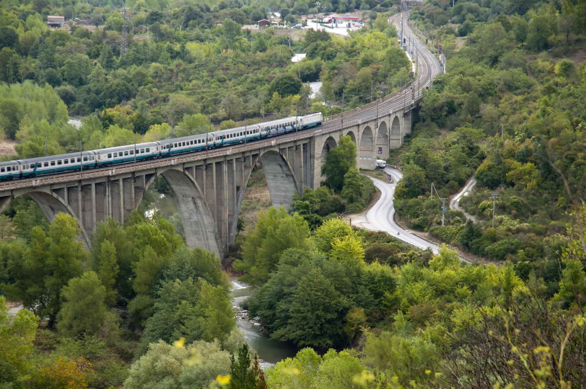 Rail and road bridges viewed from the old town of San Severino above the valley of the river Mingardo.