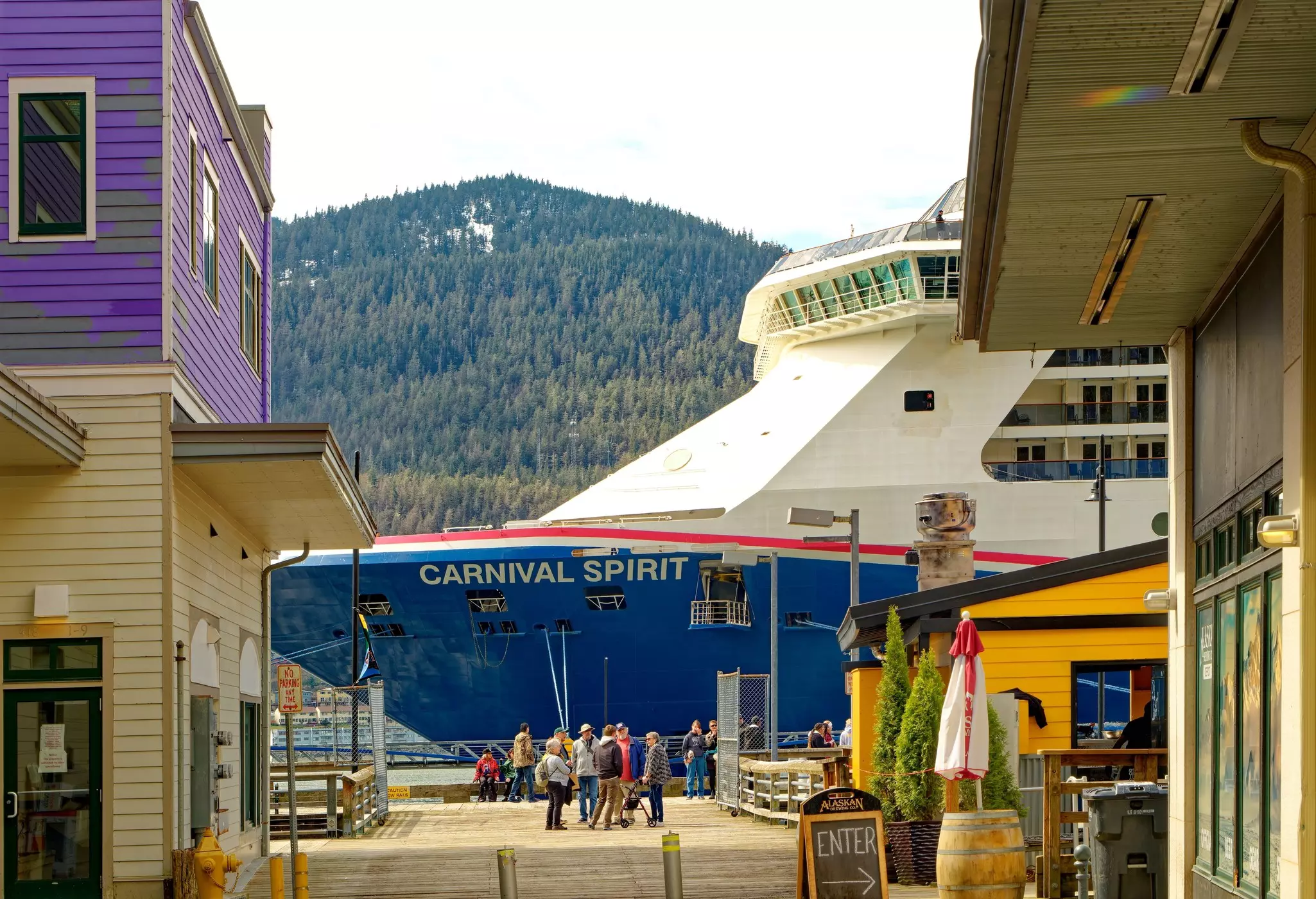 A cruise ship next to the wooden dock at Juneau, Alaska.