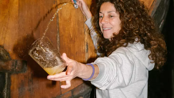 Tapping a cask of Green Spain's famous cider.