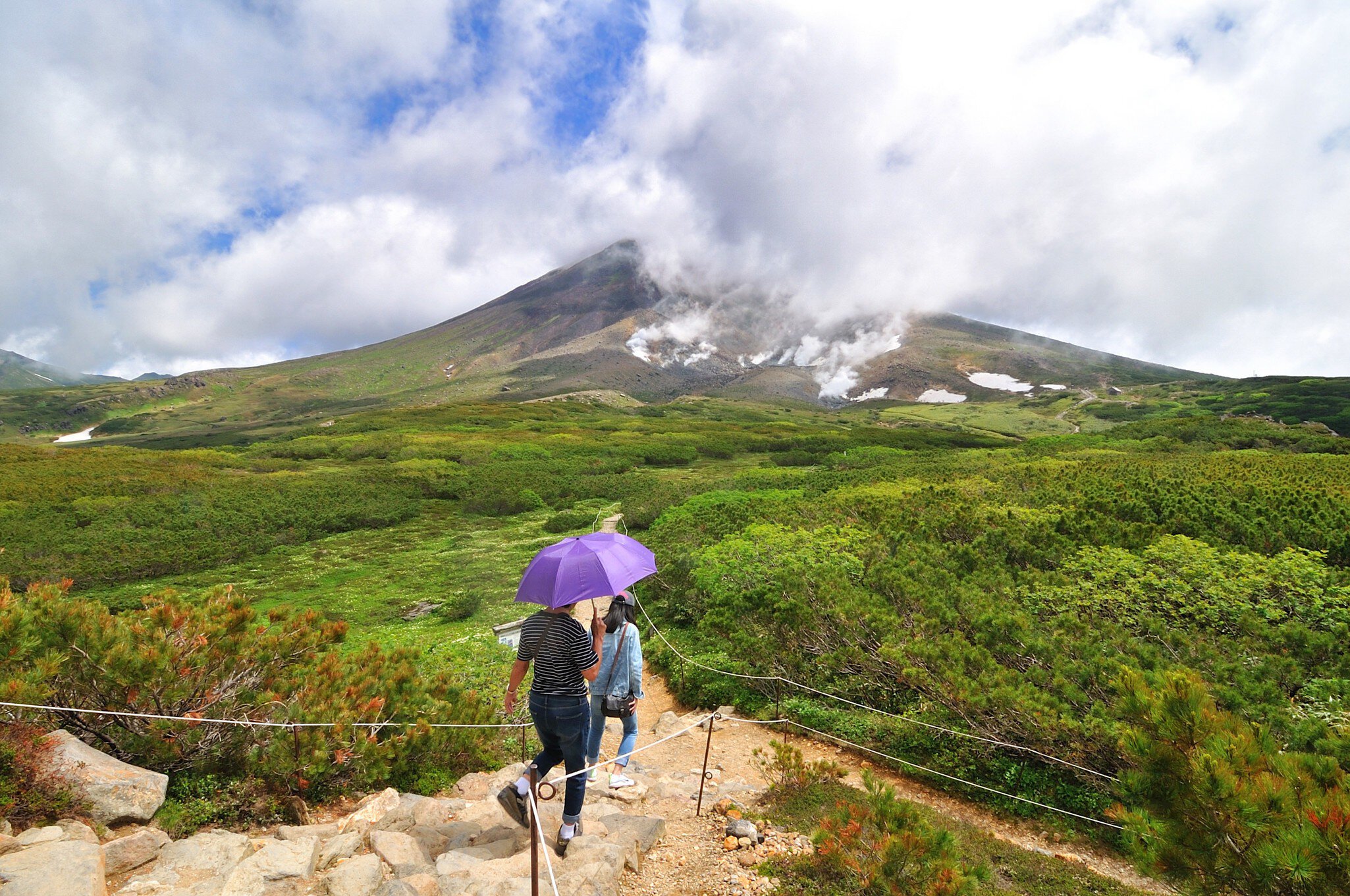 Hikers on the trail around the ropeway's upper station at Asahi-dake Mountain (Mt. Asahidake).