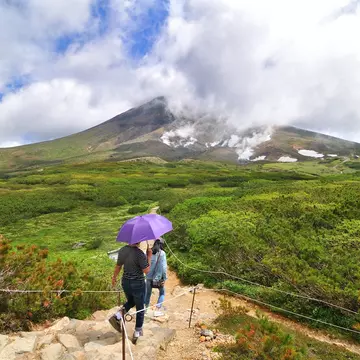 Hikers on the trail around the ropeway's upper station at Asahi-dake Mountain (Mt. Asahidake).