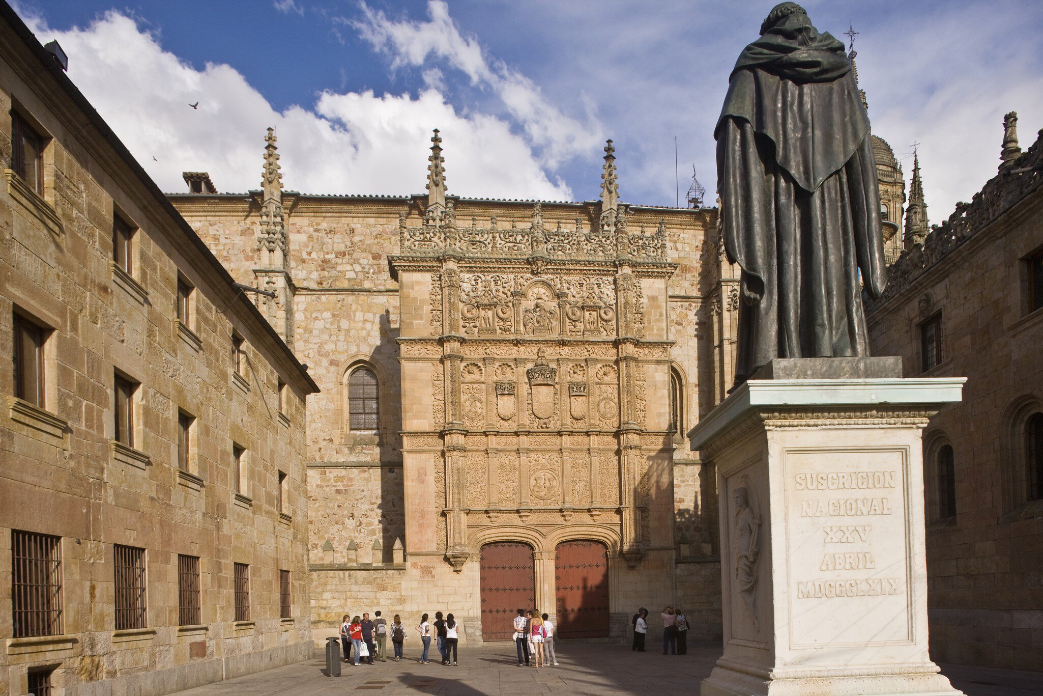 Visitors at the Universidad Civil on a sunny day in Salamanca, Spain.