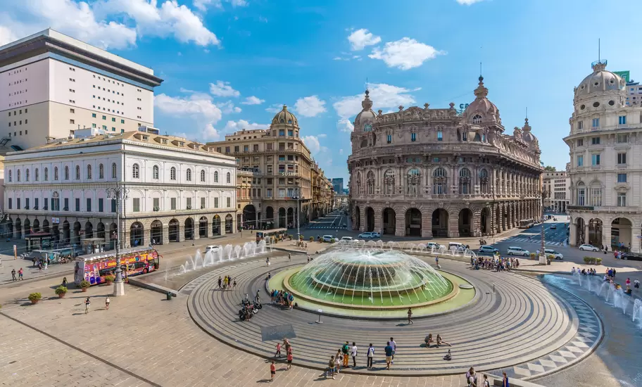 A view over the broad Piazza de Ferrari in Genoa, surrounded by historic buildings, Liguria, Italy.