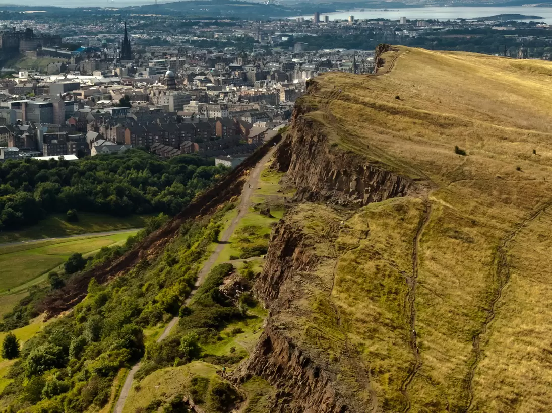 The majestic hill overlooking the city of Edinburgh on a sunny day.