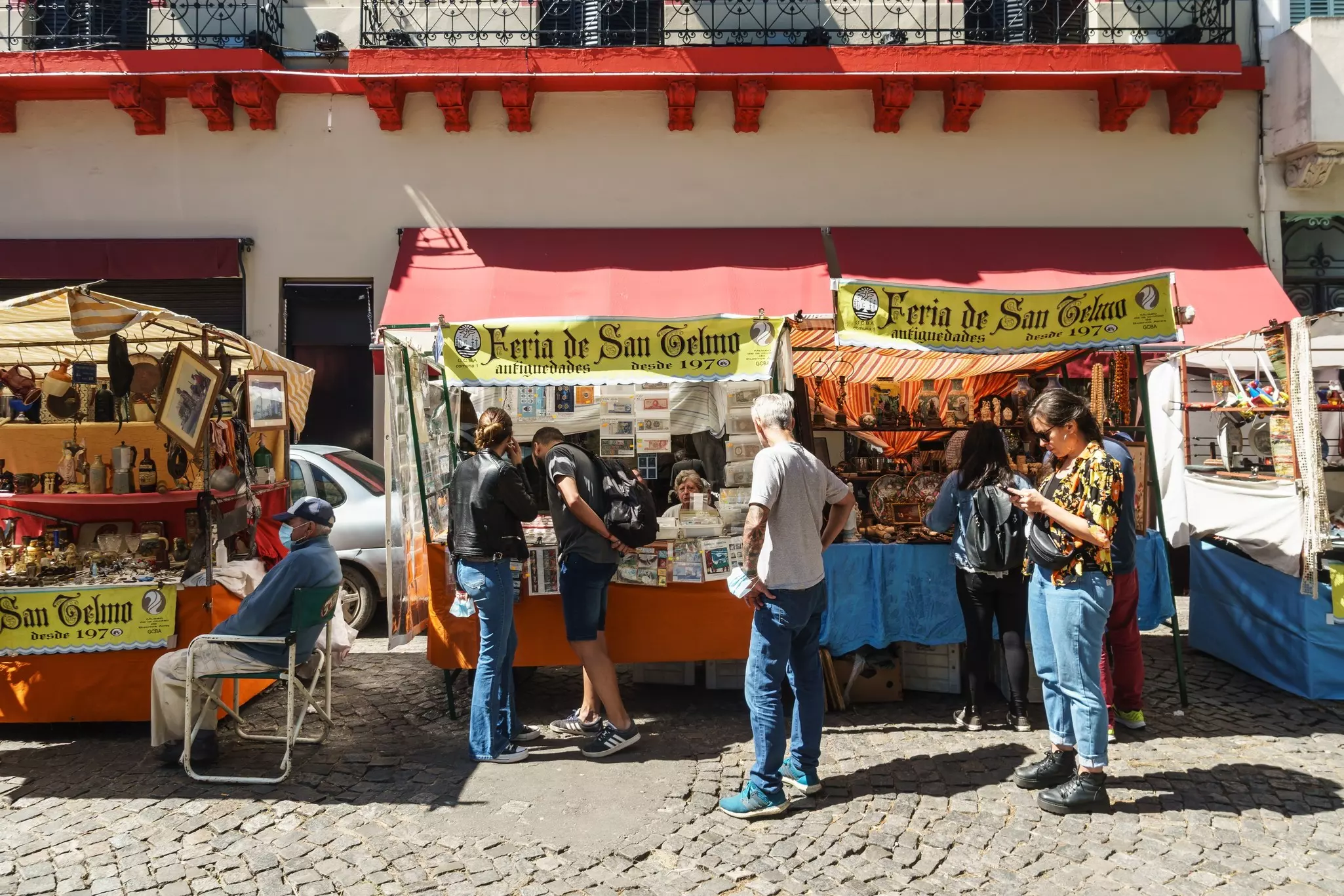 Buenos Aires, Argentina - March 20 2022: People stoll around the San Telmo Feria flea market in Buenos Aires, Argentina capital city.