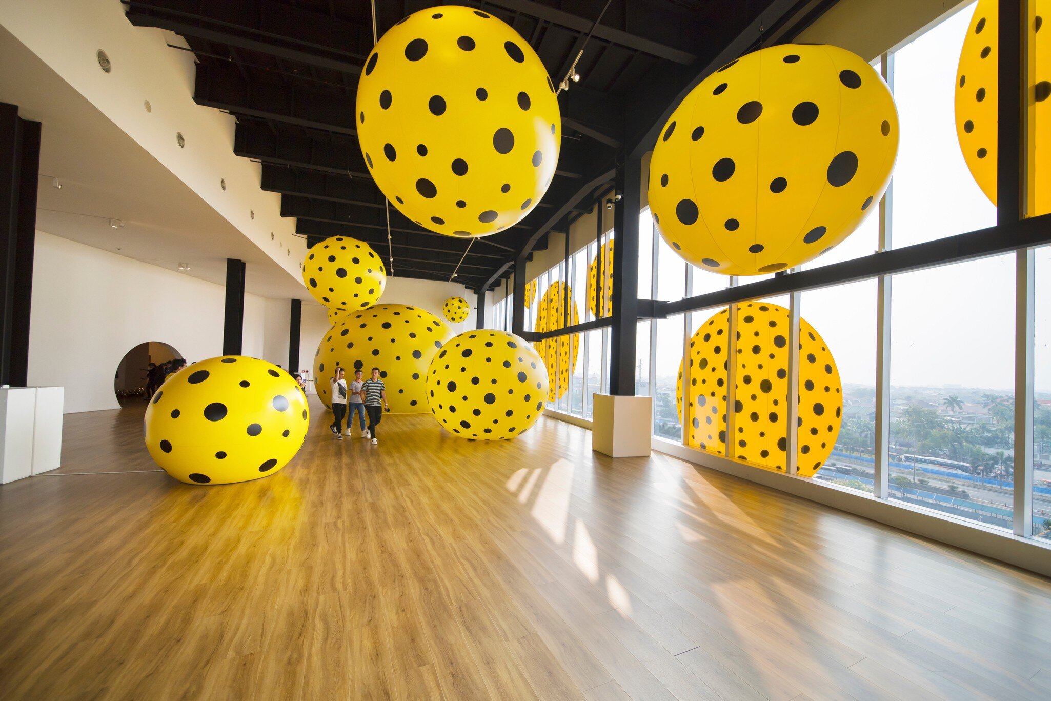 JULY 31, 2018: Visitors walking past yellow artworks in the Museum Macan.
1149315860
abstract, art, artist, artistic, artwork, asia, attraction, ball, beautiful, black, color, concept, contemporary, dot, event, exhibition, famous, floor, holiday, indonesia, indoor, jakarta, japan, kusama, looking, macan, male, man, modern, museum, obsession, people, polka dots, teenager, tourism, tourist, travel, visitor, walking, window, wood, wooden, yayoi, yayoi kusama, yellow