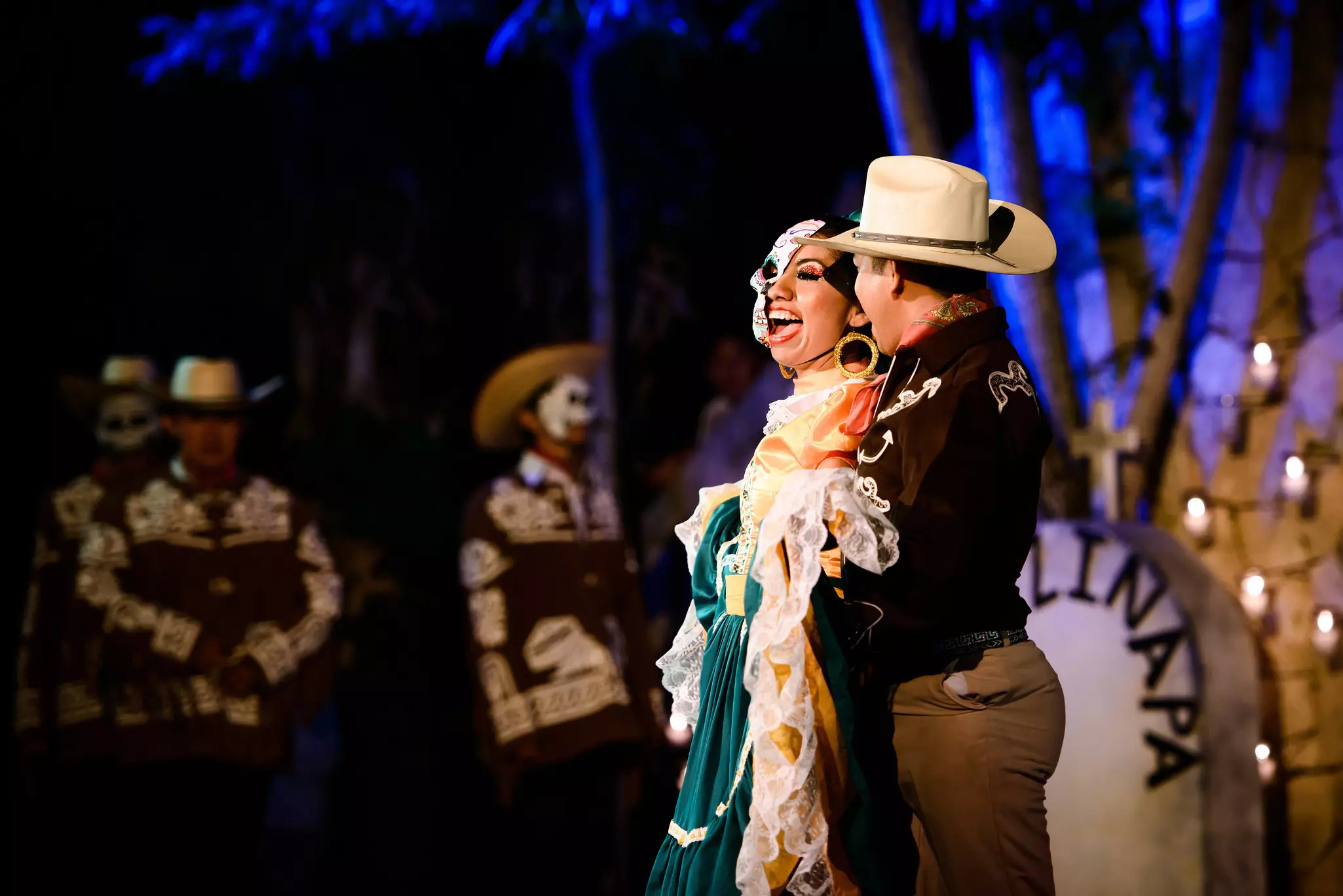 Dancers in costume embrace at a of Day of the Dead (Día de Muertos) celebration at Xcaret, Playa del Carmen, Quintana Roo, Mexico