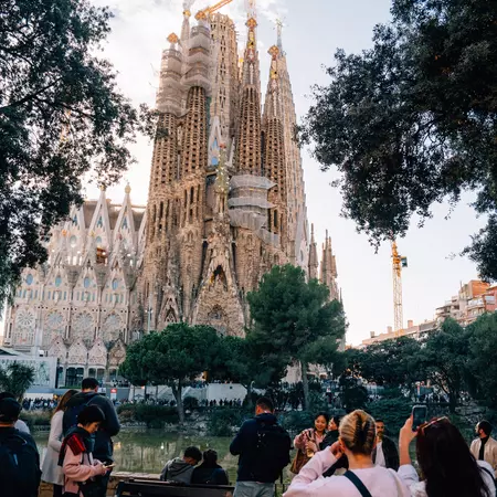 Group of people in front of Sagrada Familia basilica in Barcelona. 
